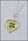 Silver Trimmed Heart Mirage Necklace with Four Leaf Clover