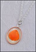 Silver Trimmed Oval Mirage Necklace with Orange Rose Petal