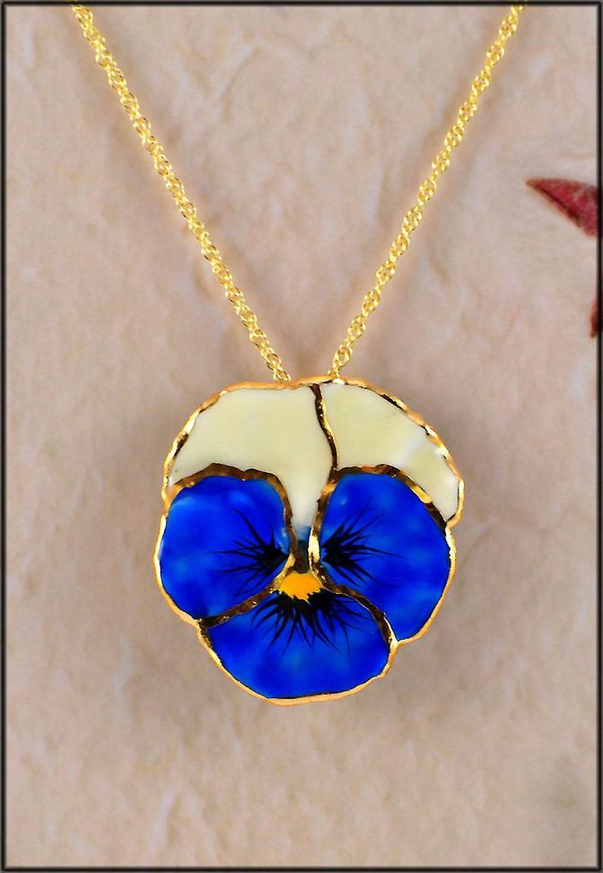 Necklace with blue pansy pendant in cold porcelain with bead