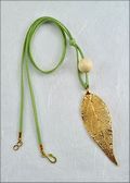 Gold Evergreen Necklace with Bead on Leather Cord