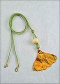 Gold Ginkgo Necklace with Bead on Leather Cord