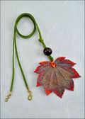 Iridescent Full Moon Leaf Necklace with Bead on Leather Cord