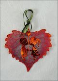 Sweet Kisses Silhouette on Real Cottonwood Leaf in Iridescent Orn.